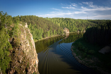 Ural river Iset, with a rocky forest shore, Russia