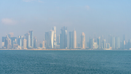 view of Westbay area with many iconic towers and builidings on misty day morning