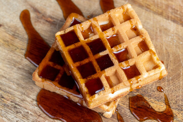 square sweet soft waffles in bee honey