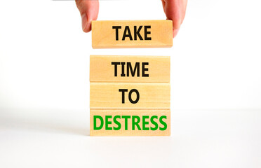 Take time to destress symbol. Concept words Take time to destress on wooden blocks. Beautiful white...