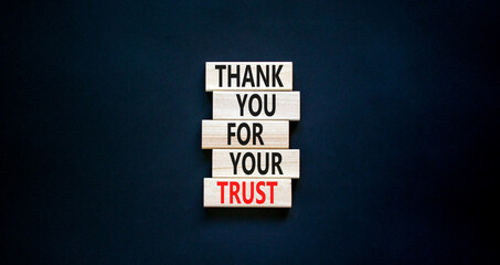 Thank you for trust symbol. Concept words Thank you for your trust on wooden blocks on a beautiful black table black background. Copy space. Business and thank you for trust concept.