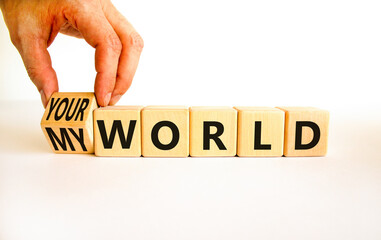 My or your world symbol. Businessman turns wooden cubes and changes concept words Your world to My world. Beautiful white table white background. Business and my or your world concept. Copy space.