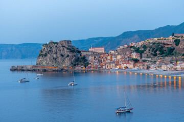 Beach of Scilla - Calabria n the blu hour, panoramic view with Castello Ruffo and townscape by night - obrazy, fototapety, plakaty