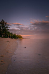 Fototapeta na wymiar Sand beach in Indian Ocean during the sunset, Mauritius
