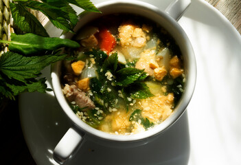  wild plants nettle, sorrel, aegopodium podagraria or ground elder .Green soup with boiled egg. It is used as food and medicine. for healthy joints