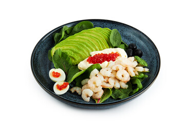 Boiled shrimps with avocado on blue plate isolated on white