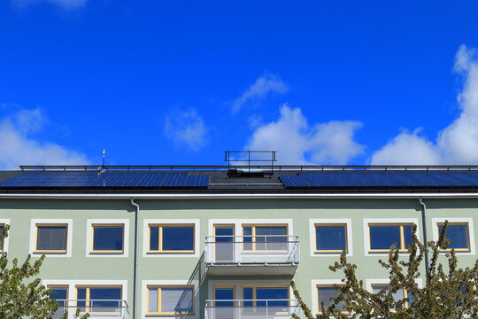Solar power at the roof of a new building. Free energy or electricity from the sun. Environmental friendly. Stockholm, Sweden, Europe.