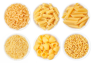 Different types of pasta in a white cup on a white background. View from above - obrazy, fototapety, plakaty