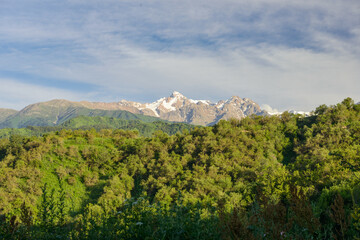 Green foothills of the Zailijsky Alatau (surroundings of the city of Almaty). Komsomol peak.