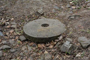 Photo of a large stone millstone from the mill .
