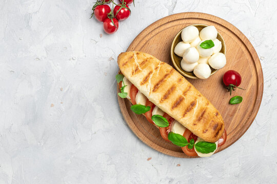 Healthy Grilled Basil Mozzarella Caprese Panini Sandwich. Delicious breakfast or snack, Clean eating, dieting, vegan food concept. top view