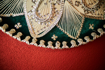 closeup photo of details of Mexican sombrero hat. Vintage Mexican sombrero hat. Velvet Mexican colorful Sombrero. selective focus