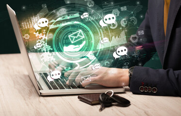 Business hand typing on a modern laptop