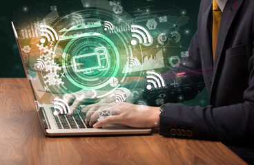 Business hand typing on a modern laptop