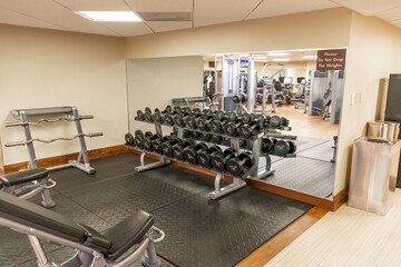 Fototapeta na wymiar Exercise equipment in a fitness gym