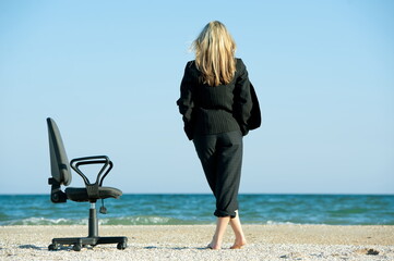 Business woman on the beach