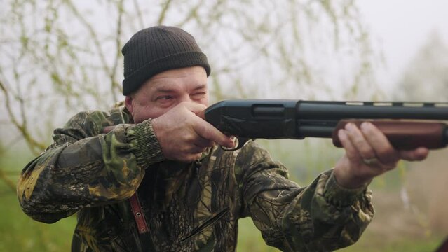 The hunter saw the target and aims at it