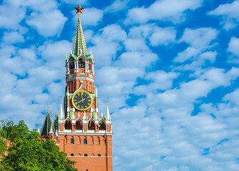 Spasskaya tower in Moscow against a blue sky with clouds. The main tower of the Moscow Kremlin,...