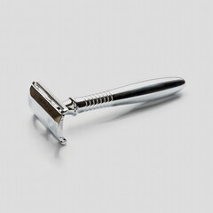 Vintage safety metal razor isolated on a white background. T - shaped metal razor.