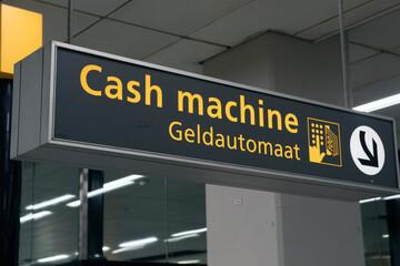 Cash machine information sign reference on a airport