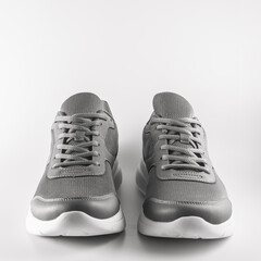 grey sneakers on a white background