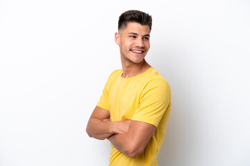 Young caucasian man isolated on white background looking to the side and smiling