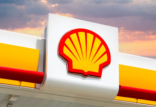 Emblem of the Royal Dutch Shell oil company against a sky