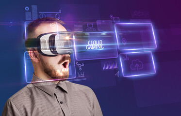 Fototapeta na wymiar Businessman looking through Virtual Reality glasses, tech concept