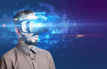 Businessman looking through VR glasses