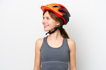 Young cyclist English woman isolated on white background looking side