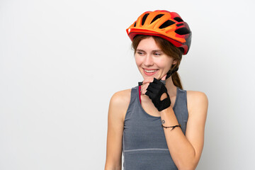 Obraz na płótnie Canvas Young cyclist English woman isolated on white background looking to the side and smiling