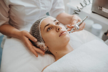 Woman receiving bio oxidation therapy at spa salon. Cosmetology beauty procedure. Rejuvenation...