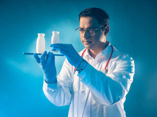 Benefits probiotics. Man doctor with bottles of probiotics. Medic with tablet. Food products with...