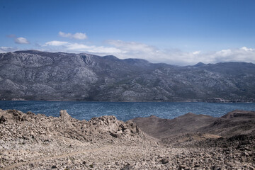 Blue sea and rocky mountains of Croatia in a clear day