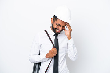 Young architect Brazilian man with helmet and holding blueprints isolated on white background laughing