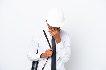 Young architect Brazilian man with helmet and holding blueprints isolated on white background with tired and sick expression