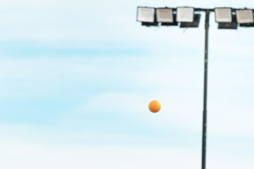 Beach tennis ball in the air