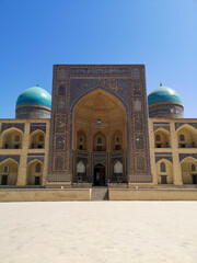 Mir Arab Madrasasi mosque with blue towers - Bukhara, Uzbekistan