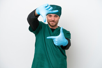 Surgeon Brazilian man in green uniform isolated on white background focusing face. Framing symbol