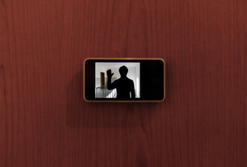 Monitor digital peephole watching a stranger outside the door - obrazy, fototapety, plakaty