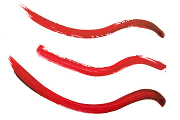 three red paintbrush strokes on white