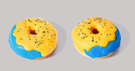 blue donut with glaze on gray pastel background