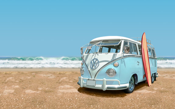 Vintage 1966 Volkswagen Bus with surfboard at the beach, front view.