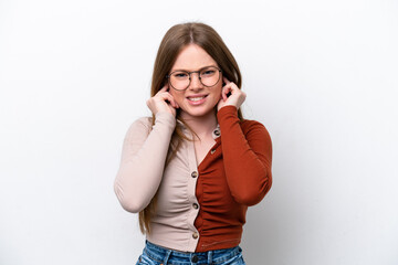 Fototapeta premium Young caucasian woman isolated on white background frustrated and covering ears
