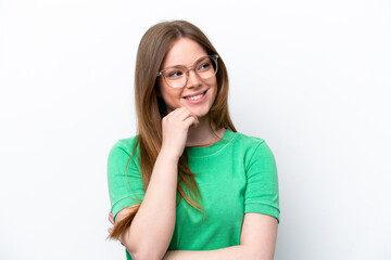 Fototapeta premium Young caucasian woman isolated on white background With glasses and thinking while looking up