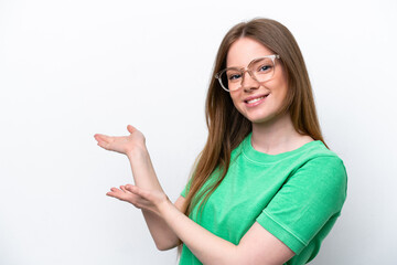 Young caucasian woman isolated on white background With glasses and presenting something