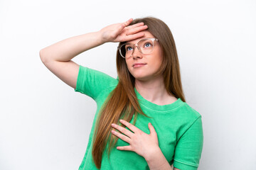 Young caucasian woman isolated on white background With glasses and tired