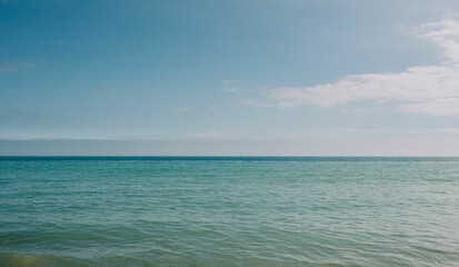 Fototapeta na wymiar blue seascape and sky along the coastline in Dorset UK