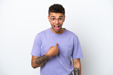 Young caucasian Brazilian man isolated on white background with surprise facial expression
