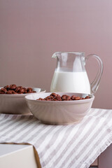 milk and chocolate cornflakes in a bowl